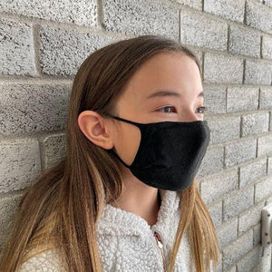 
                  
                    Girl wearing X-STATIC mask, side view
                  
                