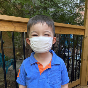 
                  
                    Kid wearing standard reusable mask
                  
                